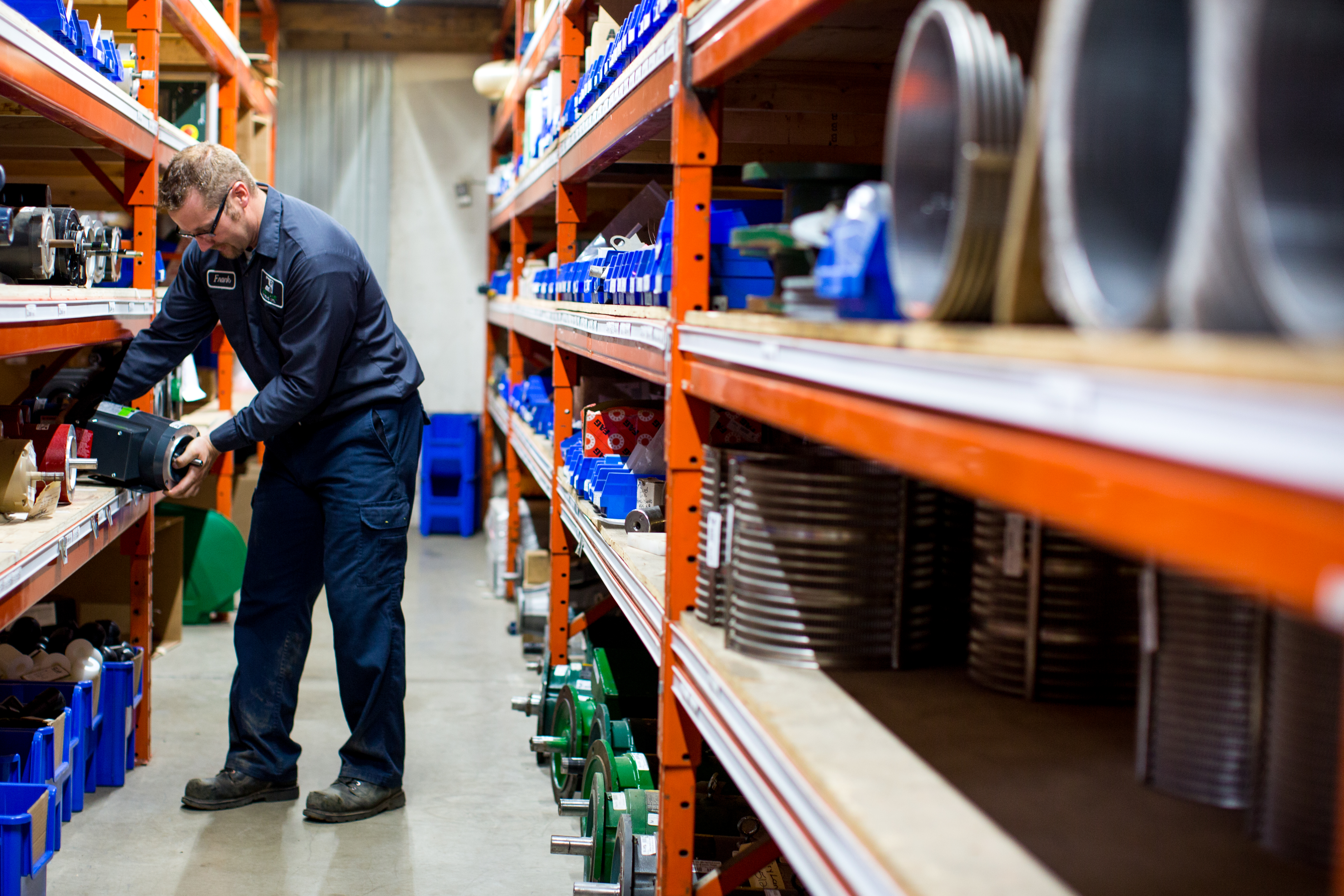 Picture of warehouse employee stocking shelves