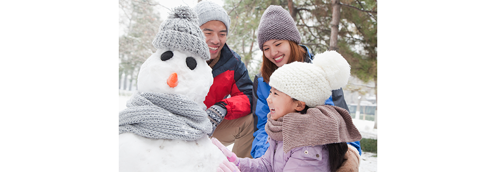 Family making a snowman
