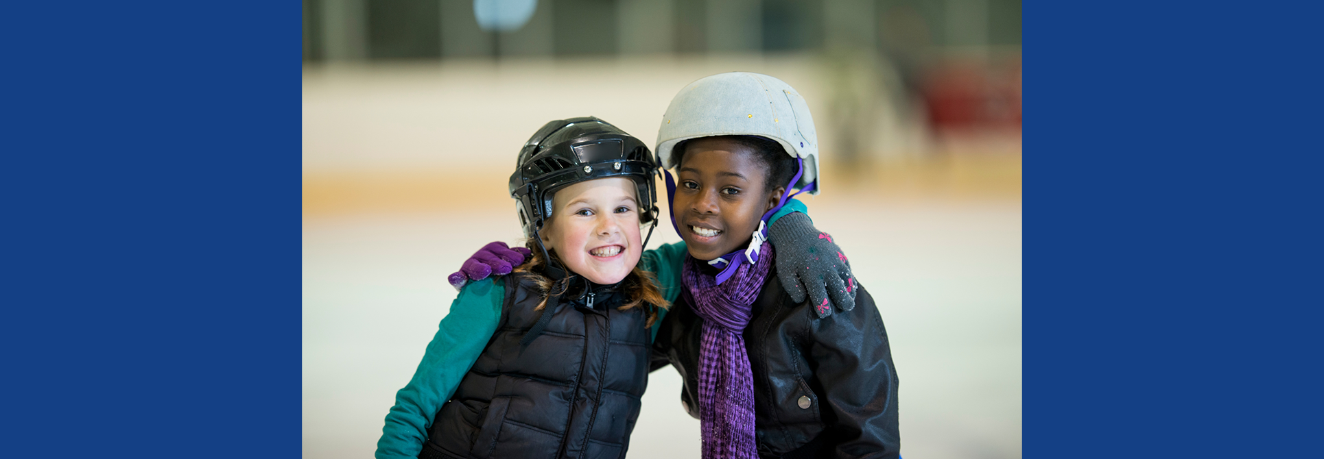 Two girls ice skating