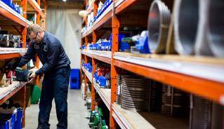 Picture of warehouse employee stocking shelves