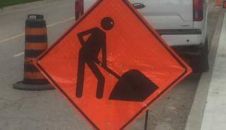Picture of Men at Work construction signage
