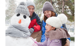 Family making a snowman