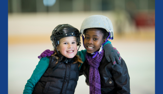 Two girls ice skating