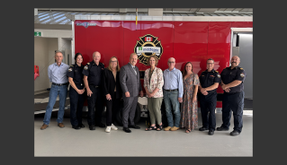 group in front of MCFS Decon Trailer