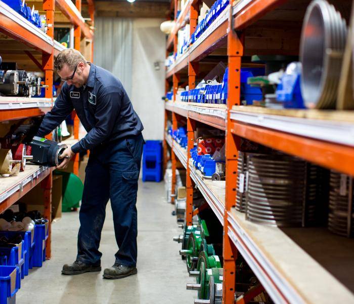 Picture of warehouse employee stocking shelves