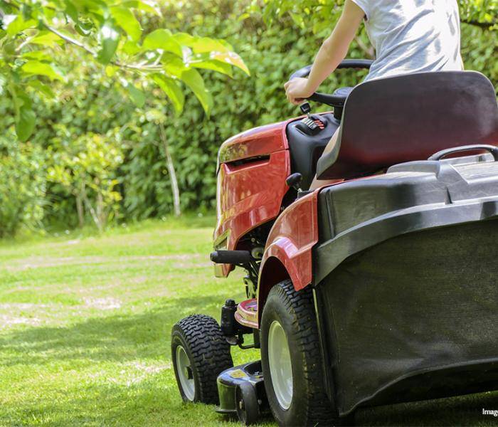 Mowing the lawn on a riding mower
