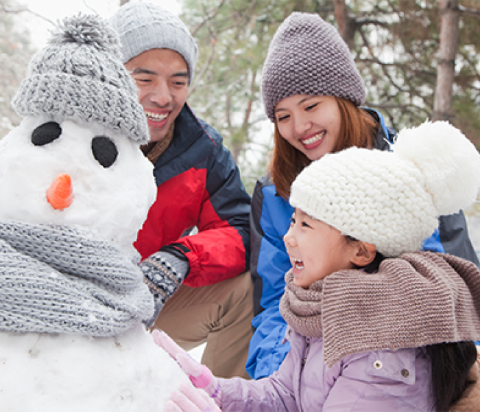 Family making a snowman