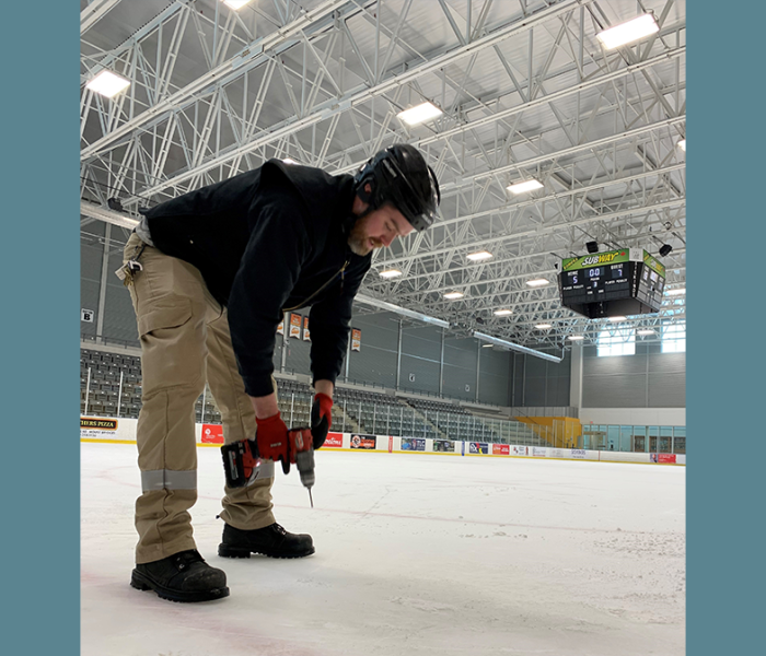 Middlesex Centre staff measure the ice thickness at Komoka Wellness Centre arenas