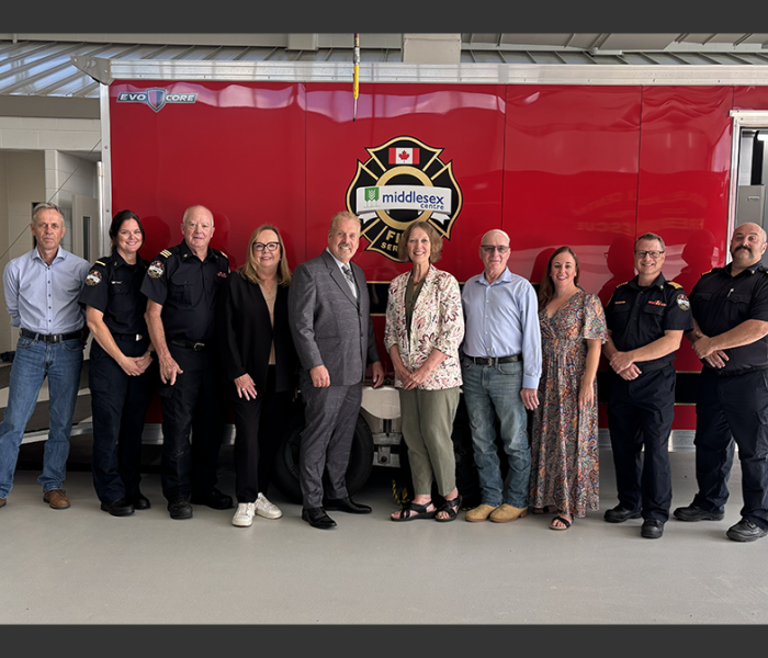 group in front of MCFS Decon Trailer
